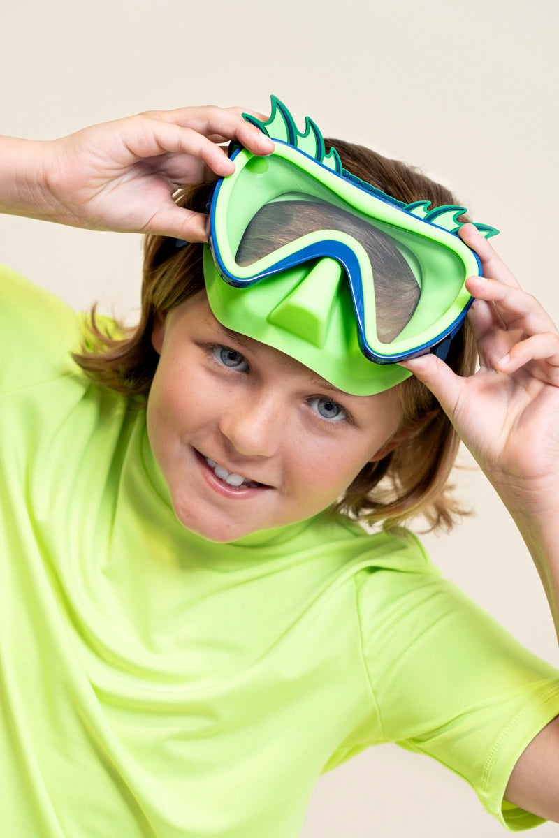 kids posing and smiling wearing creature green kids' swim mask showing green nose piece and blue colors and silicone fins 