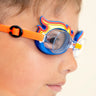 close up image of boy wearing mini flame kids swim goggles showing silicone flame detail on a blue swim goggles with an orange strap and nose piece