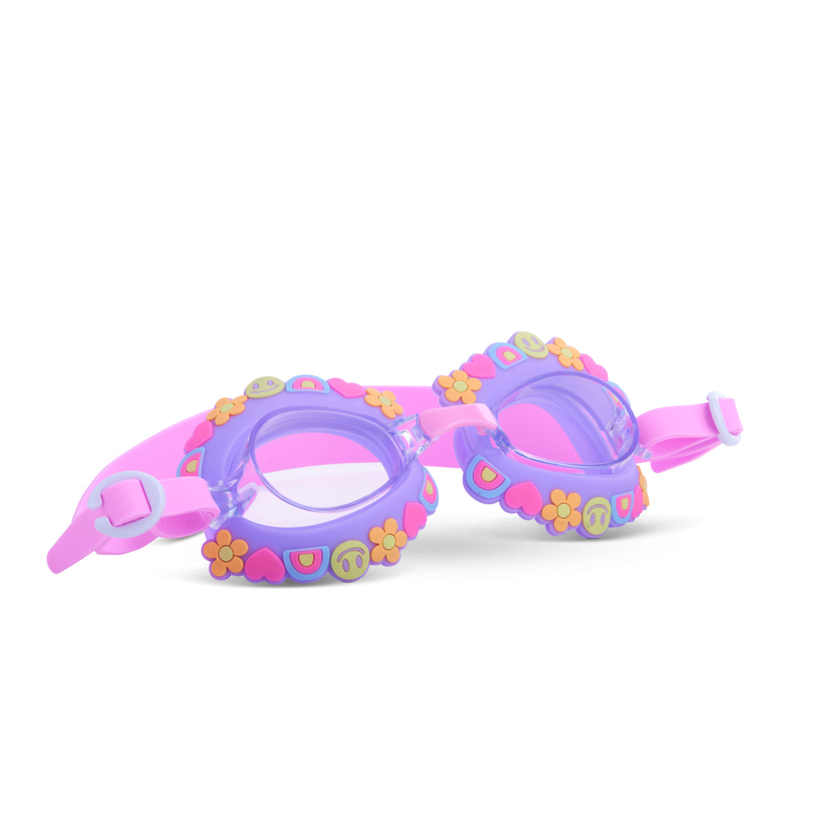 angled product shot featuring a purple goggle and pink strap with silicone smiley faces and charms wrapping around the lenses