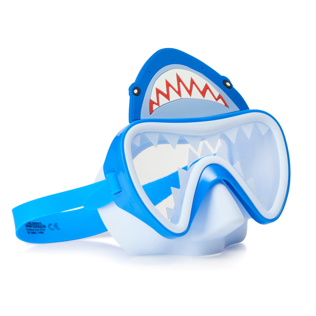 angled product shot of shark bite swim mask showing shark teeth screen printed on the lens and a silicone shark above the frame also featuring a light blue nose piece